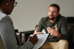 Man talks to therapist during talk therapy session