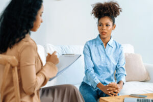 Woman talks to therapist about mindfulness based therapies