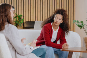 Person struggling with chronic anxiety talking to therapist