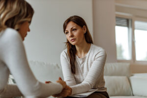 woman talks with therapist about advancing depression treatment with tms and spravato